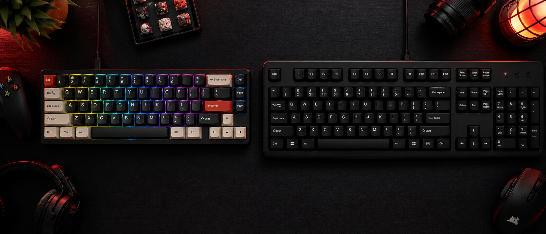 Side-by-side comparison of a compact RGB mechanical keyboard and a full-size membrane keyboard on a dark gaming desk